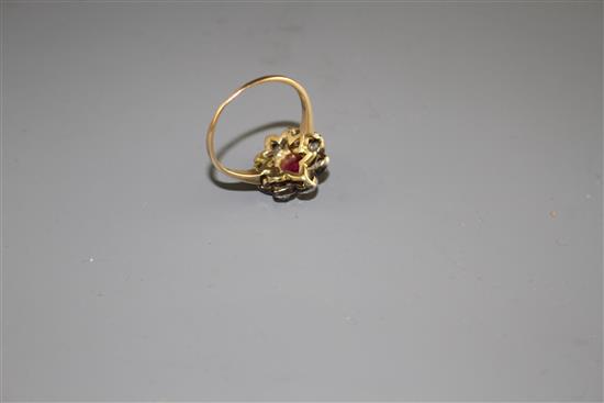 A yellow and white metal, ruby and diamond set oval cluster ring, (adapted),